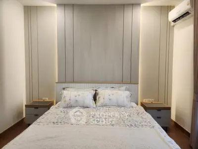 Modern bedroom with stylish headboard and cozy bedding