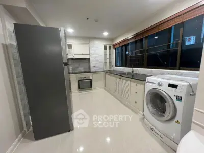 Modern kitchen with sleek appliances and spacious layout