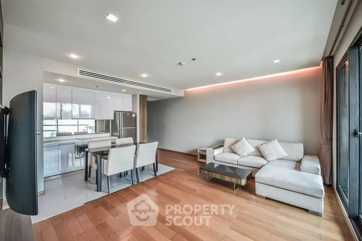 Spacious modern living room with open kitchen and stylish decor