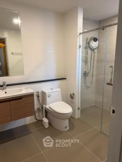 Modern bathroom with glass shower and sleek fixtures