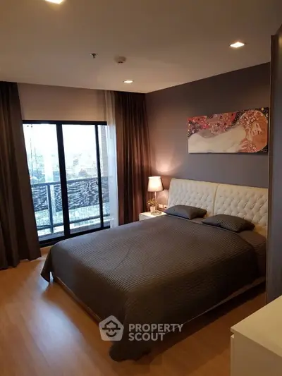 Elegant bedroom with city view and modern decor in luxury apartment