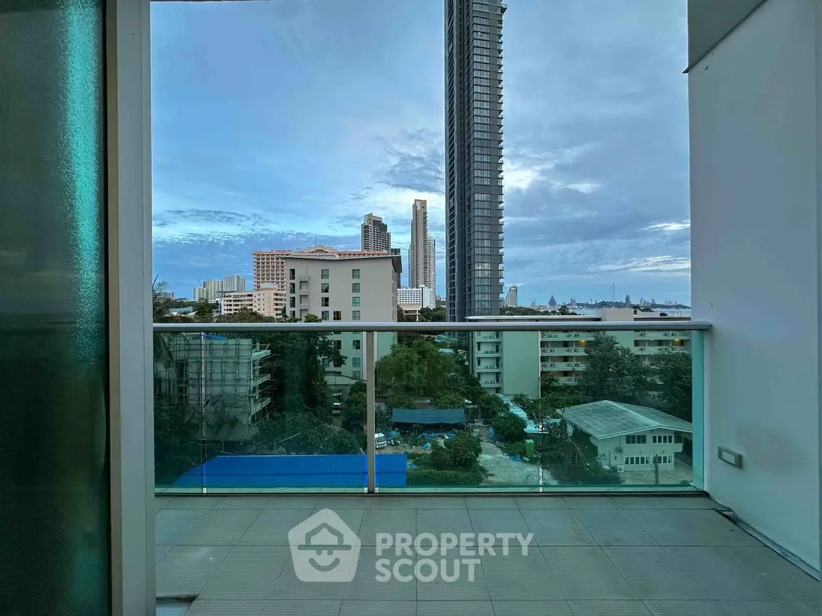 Stunning balcony view with cityscape and high-rise buildings, perfect for urban living enthusiasts.