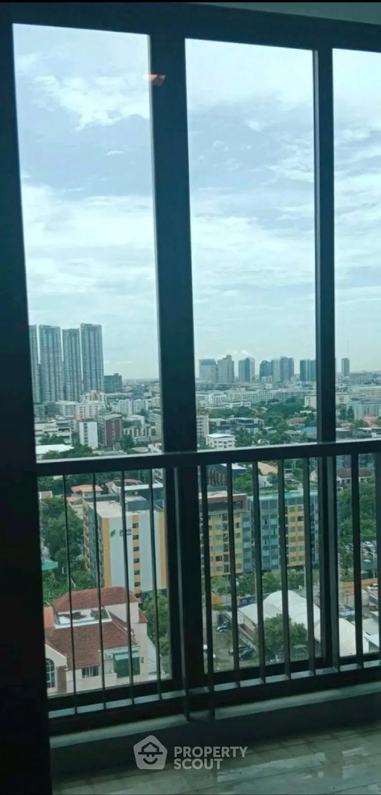 Stunning cityscape view from a high-rise balcony with expansive skyline.