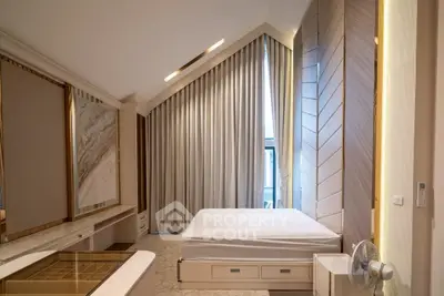 Luxurious modern bedroom with high ceiling and elegant decor