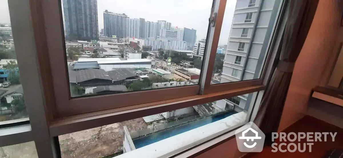 High-rise apartment with city view and large windows