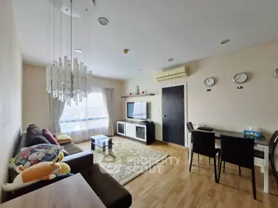 Spacious living room with modern decor and natural light