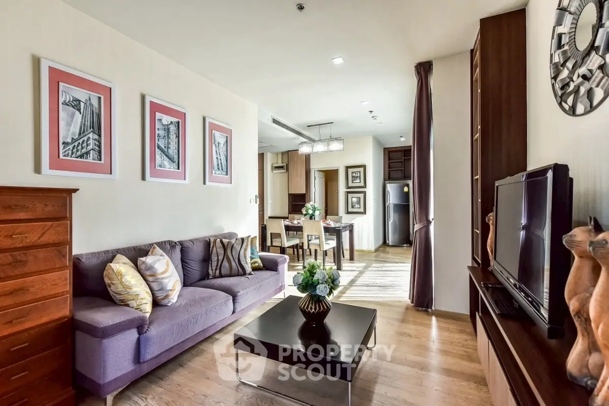 Spacious living room with modern decor and open layout in a stylish apartment.