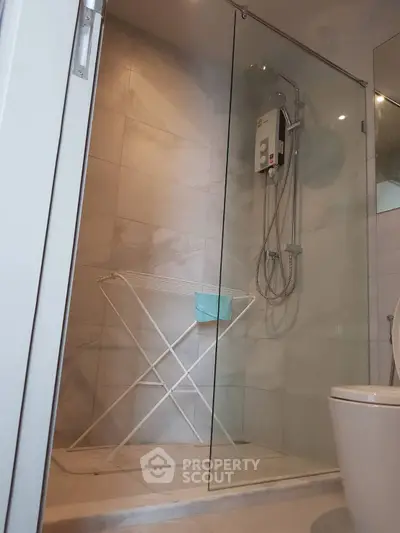 Modern bathroom with glass shower and sleek fixtures