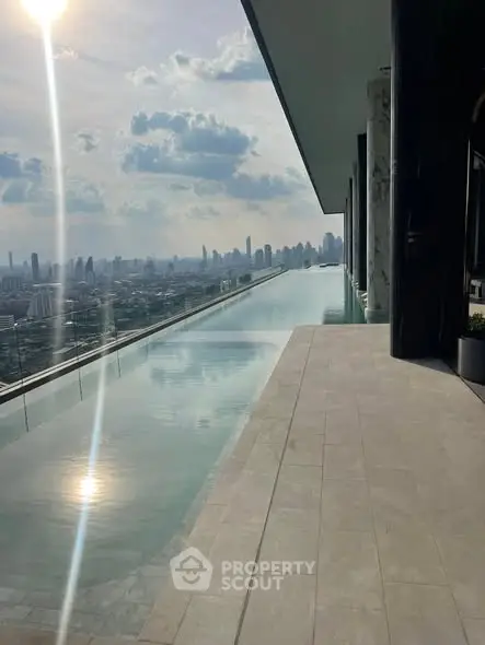 Stunning rooftop infinity pool with breathtaking city skyline view