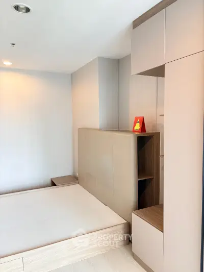 Modern bedroom with sleek built-in storage and minimalist design