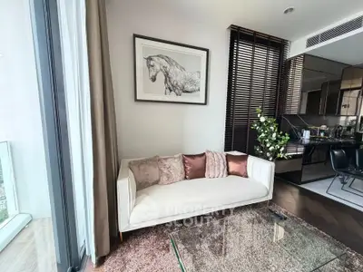 Stylish modern living room with cozy sofa and elegant decor in luxury apartment