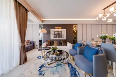 Luxurious modern living room with elegant decor and stylish furniture, featuring a spacious open layout and chic lighting.