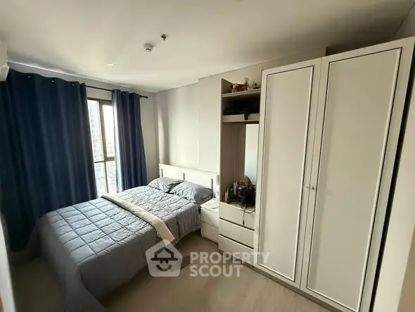 Cozy bedroom with modern furniture and ample natural light