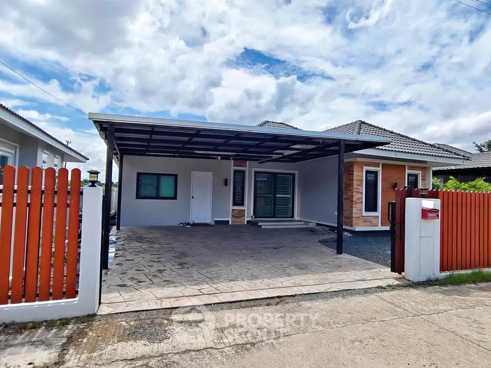 Charming single-story home with spacious carport and modern exterior design.