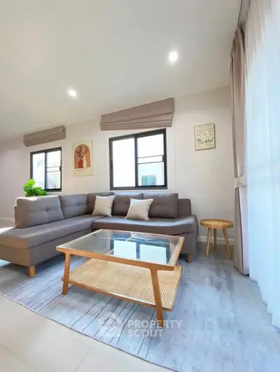 Modern living room with stylish furniture and natural light