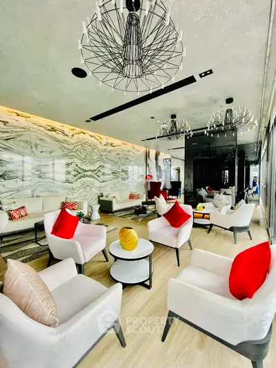 Luxurious living room with striking marble wall, modern furniture, and artistic light fixtures, perfect for upscale urban living.