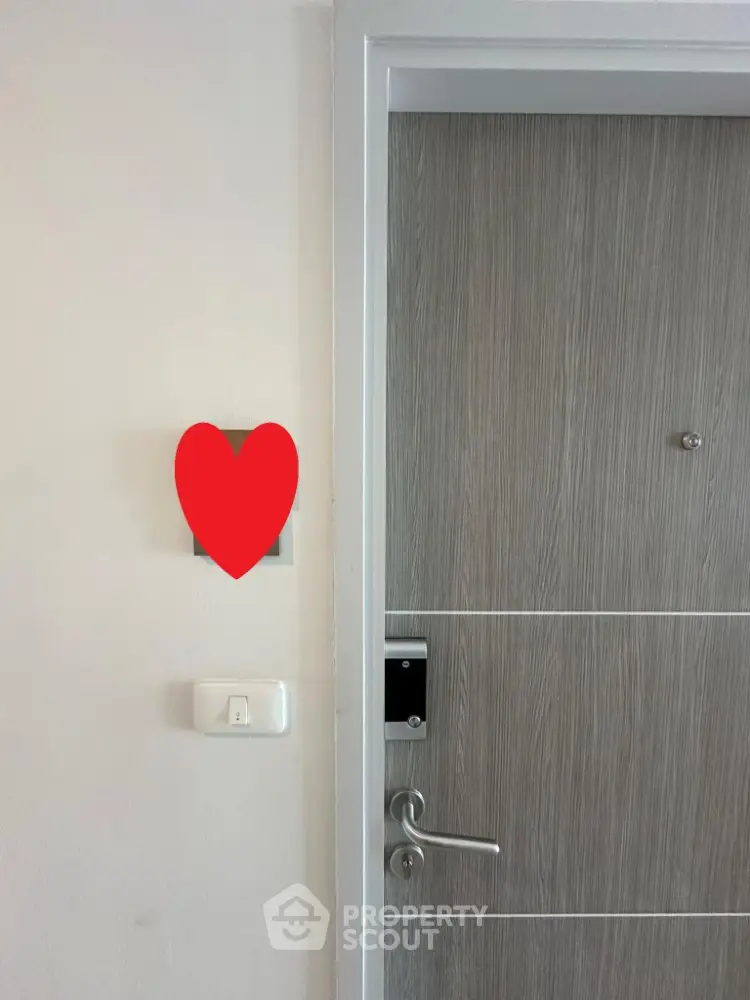 Modern apartment entrance with sleek wooden door and digital lock