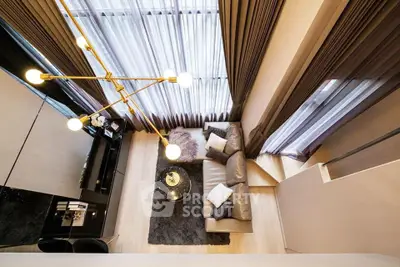 Luxurious modern living room with high ceilings and elegant lighting