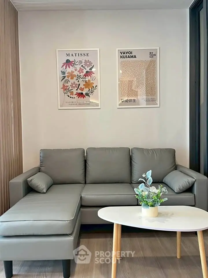 Modern living room with stylish gray sofa and chic decor