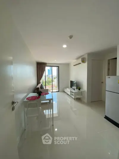 Modern living room with sleek design and city view from balcony