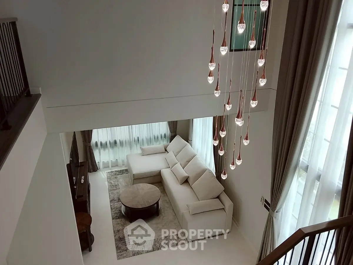 Luxurious living room with elegant chandelier and spacious seating area