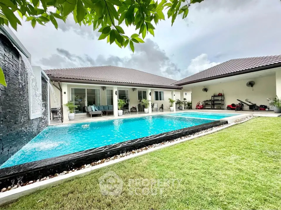 Luxurious villa with stunning pool and lush garden, perfect for relaxation and entertainment.