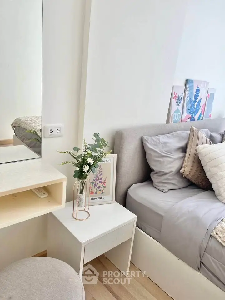 Cozy bedroom with stylish decor and comfortable bedding
