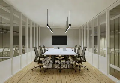Modern conference room with sleek design and ample seating in a professional office setting.