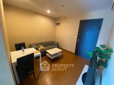 Cozy living room with modern furniture and warm lighting, perfect for relaxation and entertainment.