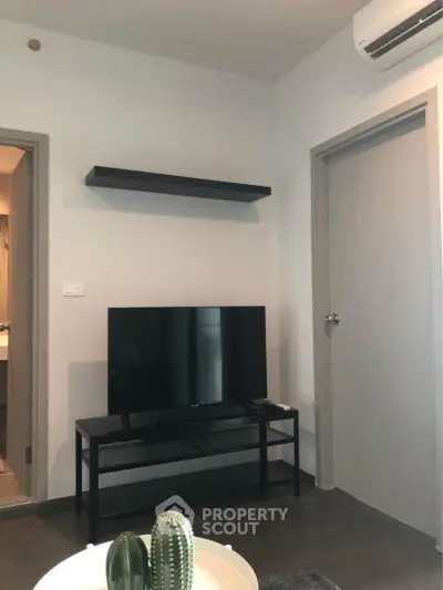 Modern living room with sleek TV setup and minimalist decor