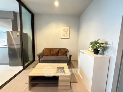 Modern living room with cozy sofa, sleek coffee table, and stylish decor in a contemporary apartment.