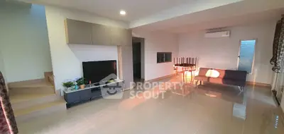 Spacious modern living room with sleek furniture and natural light