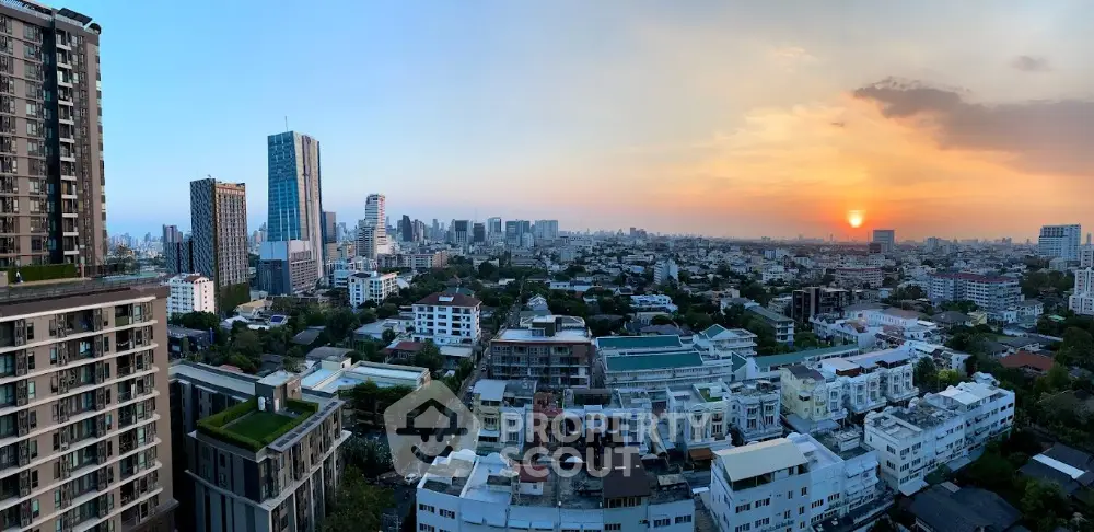 Stunning panoramic cityscape view at sunset showcasing urban skyline and vibrant architecture.