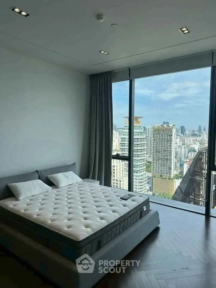 Luxurious bedroom with stunning city view and modern decor