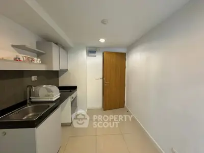 Compact kitchen with modern cabinetry and sleek design