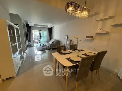 Modern living and dining area with stylish decor and natural light