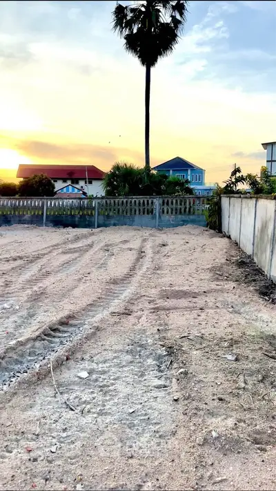 Vacant land with sunset view, ideal for development in prime location.