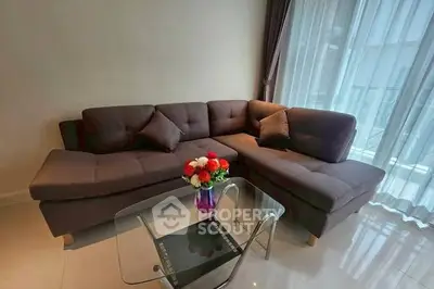 Modern living room with stylish sectional sofa and glass coffee table