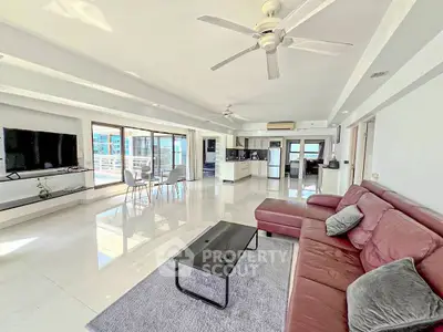 Spacious modern living room with open layout and large windows