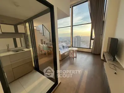 Stunning high-rise apartment with floor-to-ceiling windows and breathtaking city view.