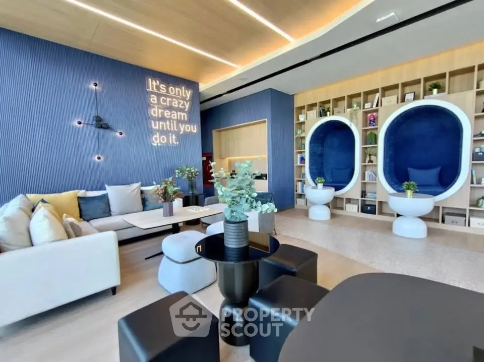 Modern living room with stylish seating and unique wall decor in a luxurious apartment.