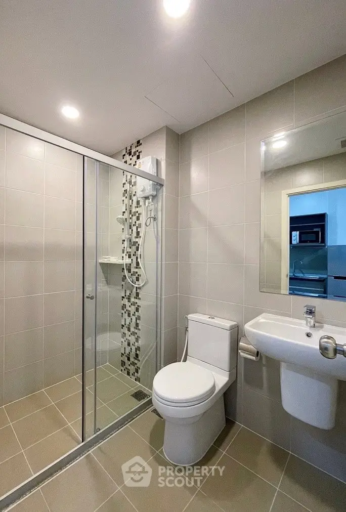 Modern bathroom with sleek shower enclosure and contemporary fixtures