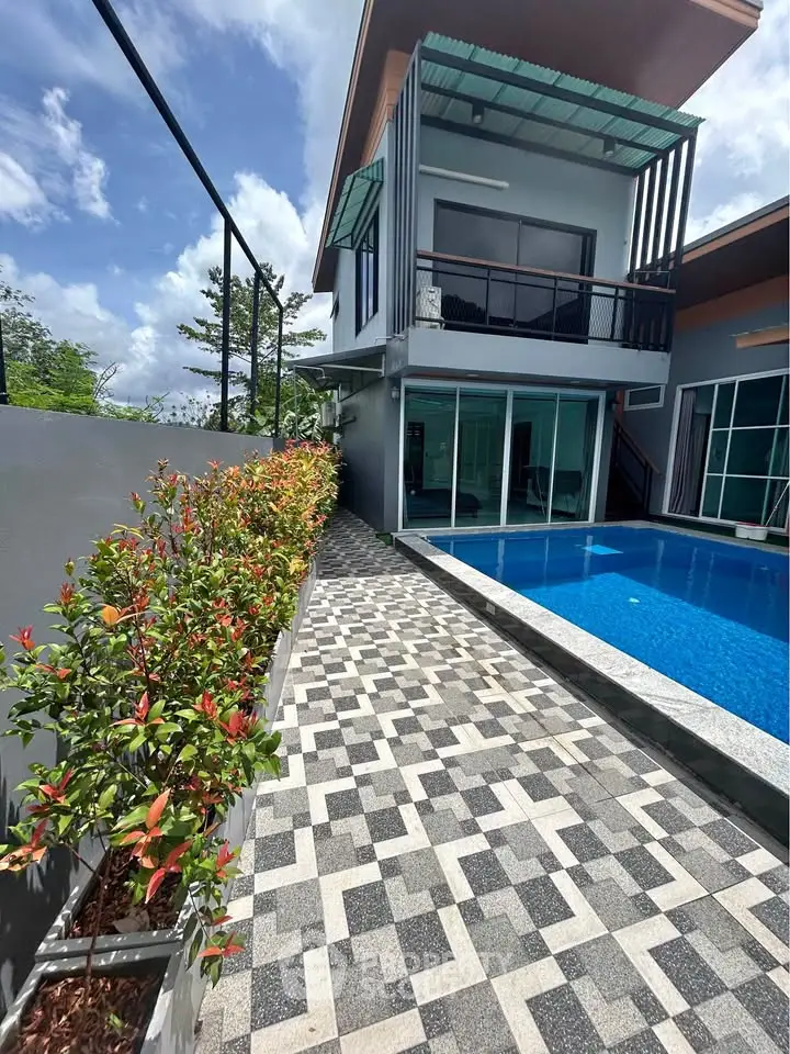 Modern two-story house with private pool and stylish exterior design