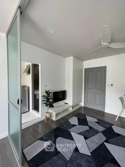 Modern living room with stylish decor and sliding glass door