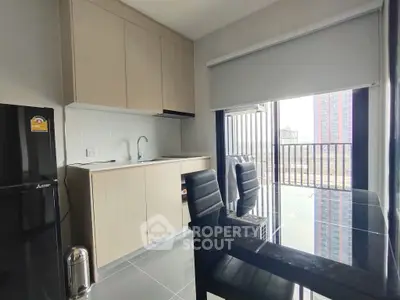 Modern kitchen with sleek design and balcony view in urban apartment