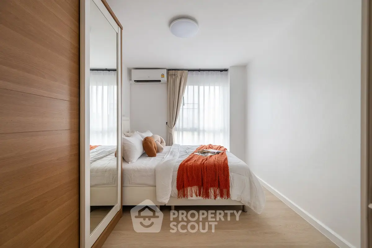 Cozy modern bedroom with natural light and stylish decor