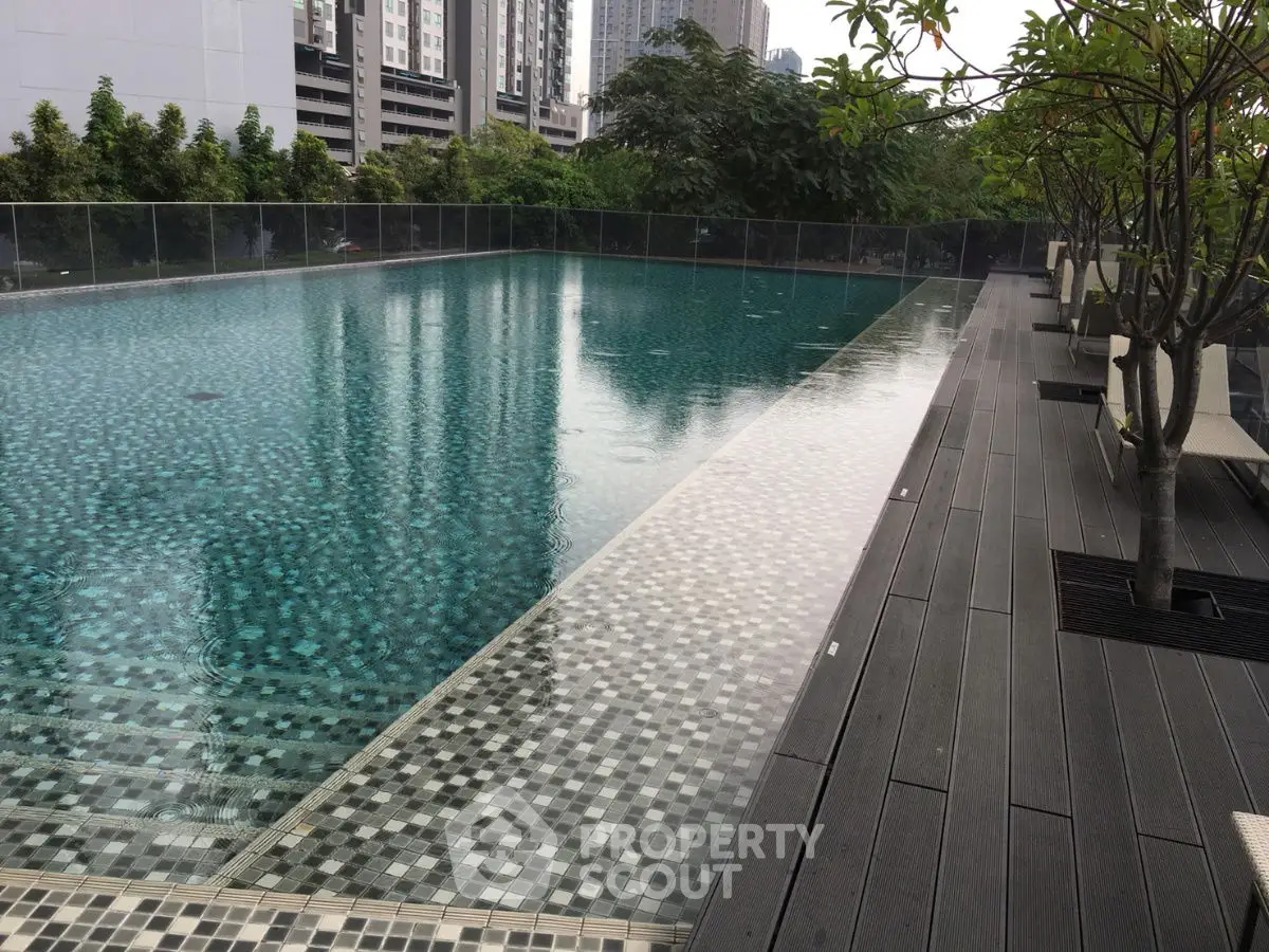 Luxurious rooftop pool with modern design and lush greenery