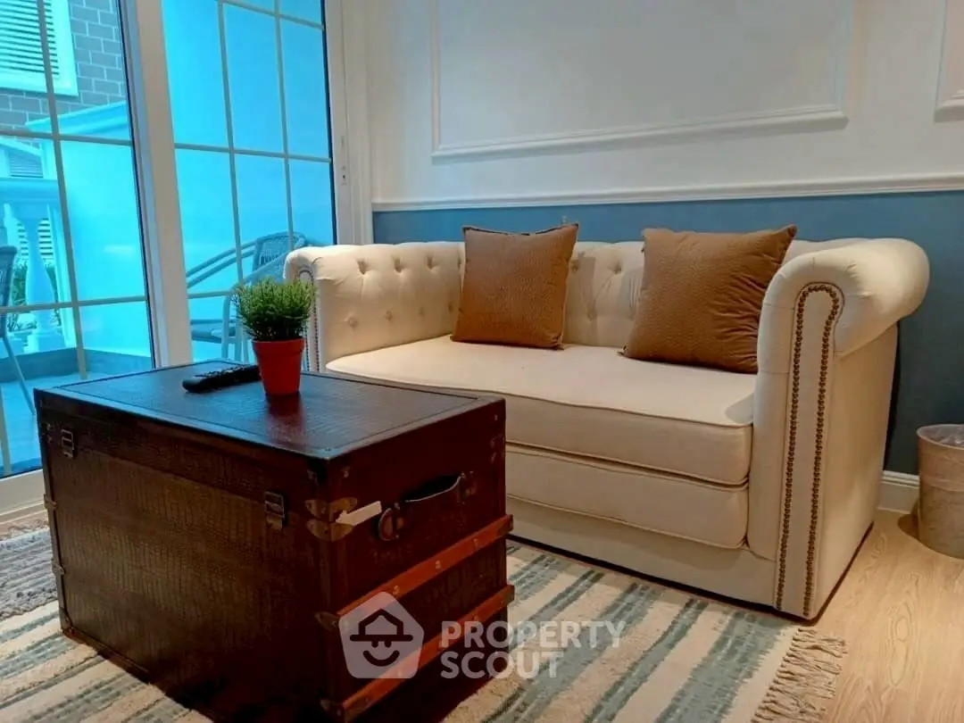 Charming living room with elegant sofa and vintage trunk coffee table