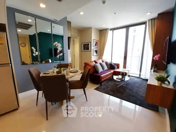 Modern living room with stylish decor and balcony access in a contemporary apartment.