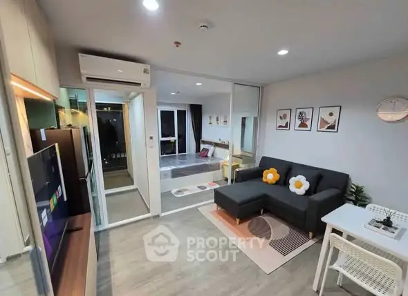 Modern living room with stylish decor and open layout in contemporary apartment.